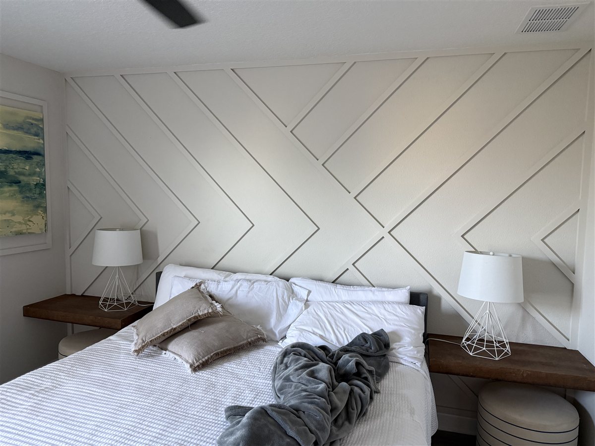 Bright bedroom with geometric accent wall