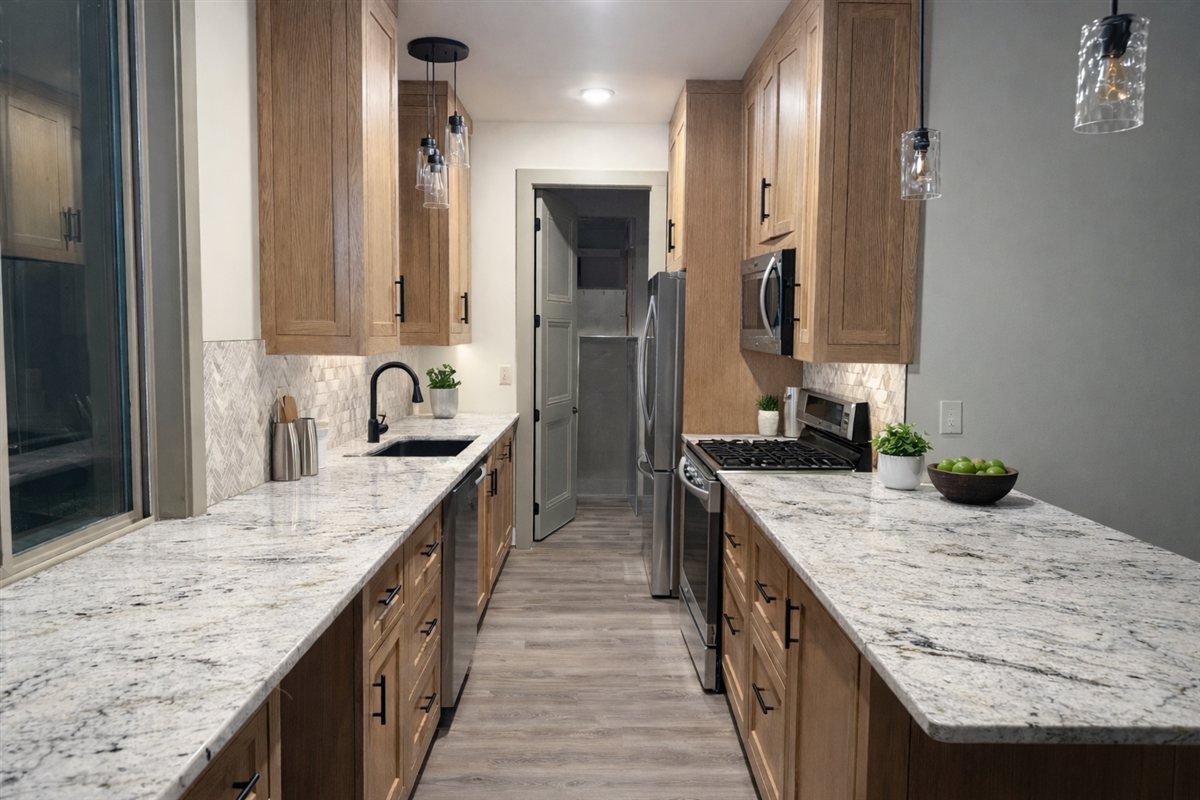 Modern galley kitchen with granite counters